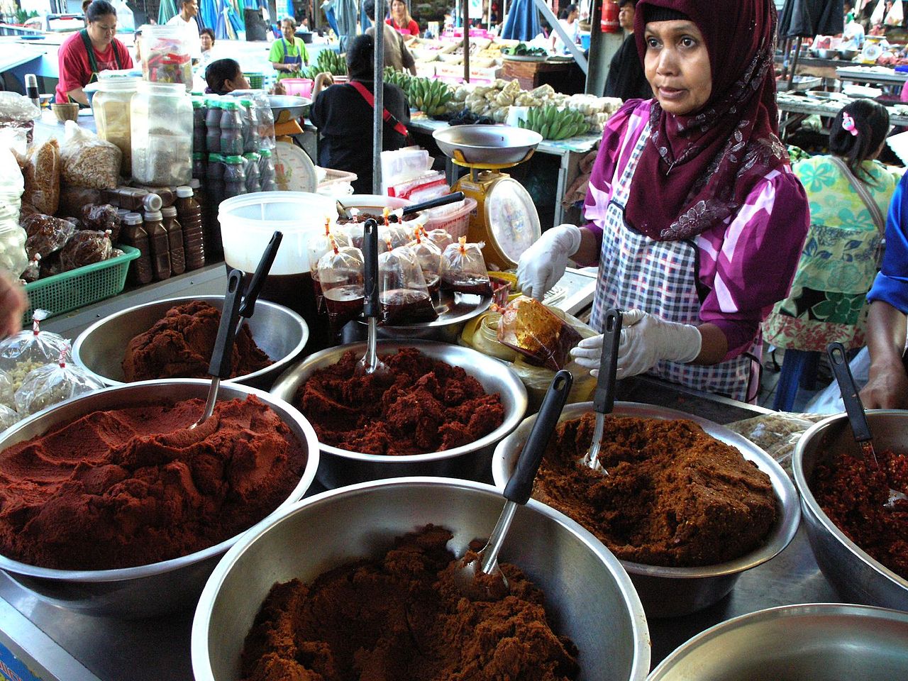 Malay-Muslim woman from Southern Thailand selling food at the market