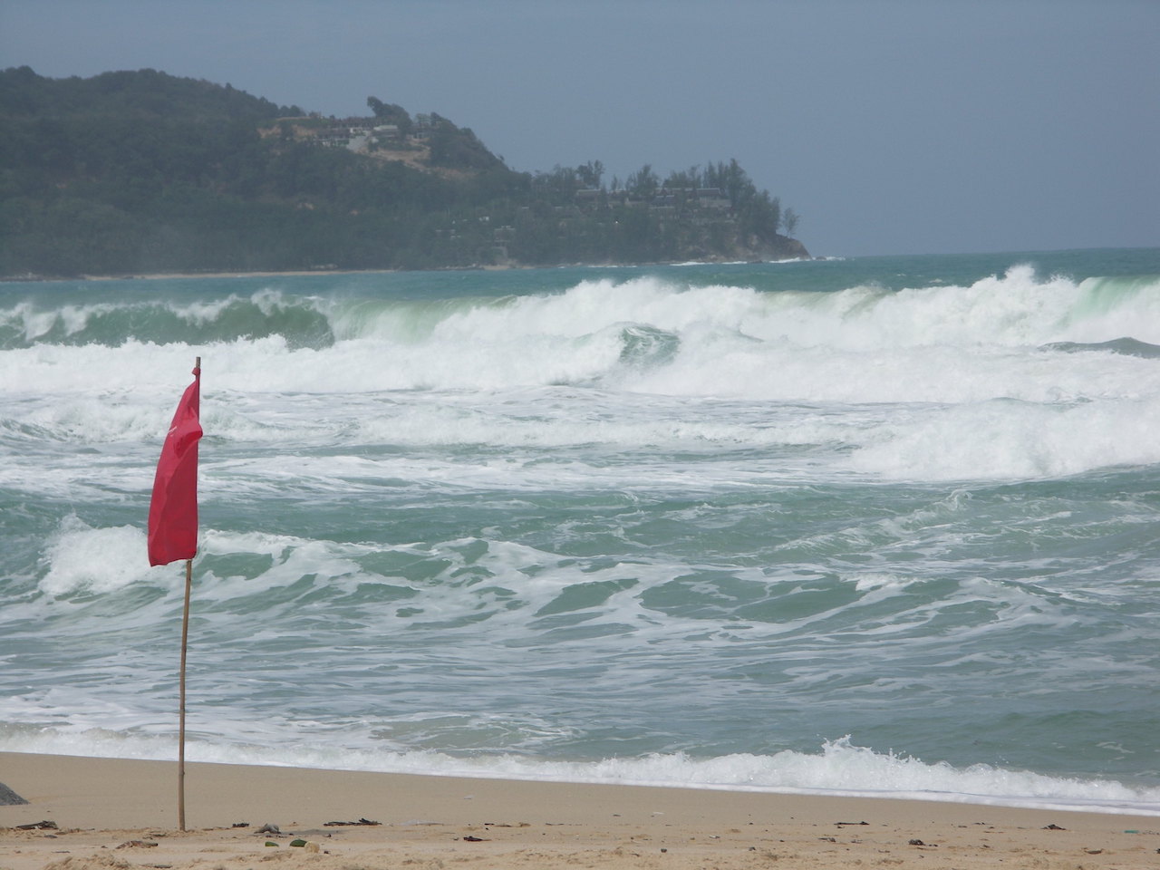 Strong waves and red flag on Surin Beach in Phuket.