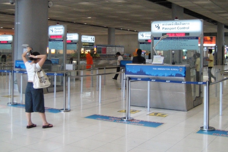 Immigration passport control counter at Suvarnabhumi airport in Bangkok.