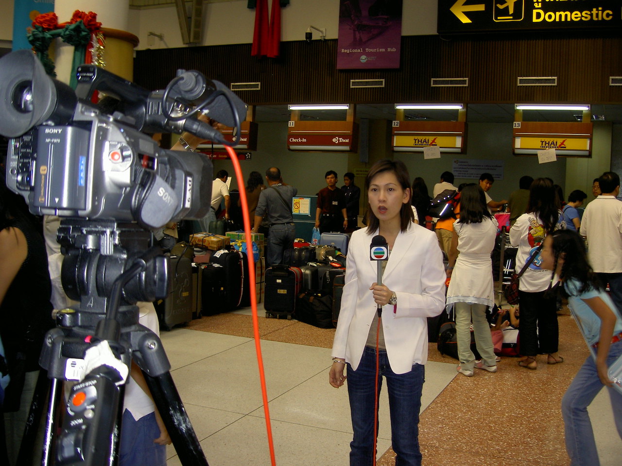 TVB News reporter at Phuket International Airport.