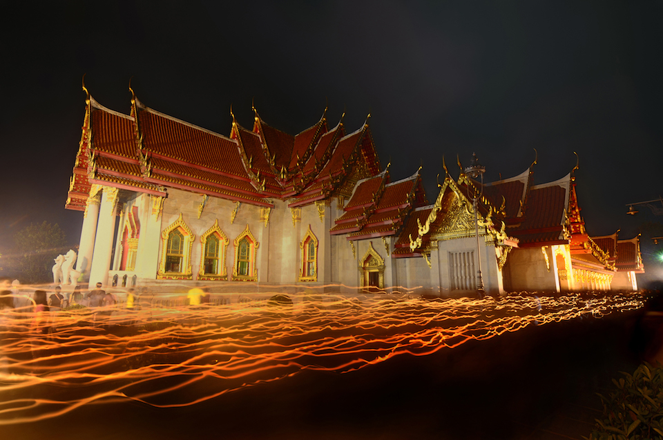 In Vesak day or Buddhist days, there is a ceremony called in Thai "Wien Tien" which Buddhist will hold their candle lights and walk around the temple or other Buddhist places 3 rounds praying and make a wish.
