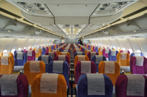 The colorful economy class cabin of Thai Airways' Airbus A330-300.