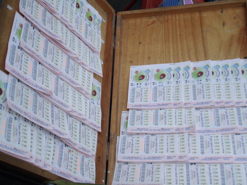Wooden box with Thai lottery tickets