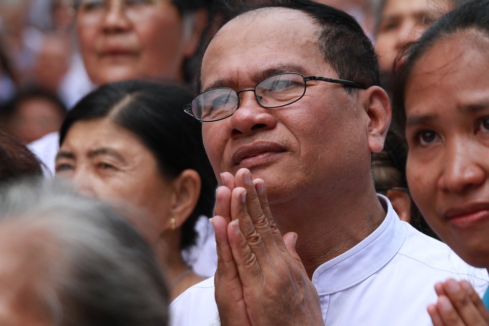 Buddhists praying at Thai temple