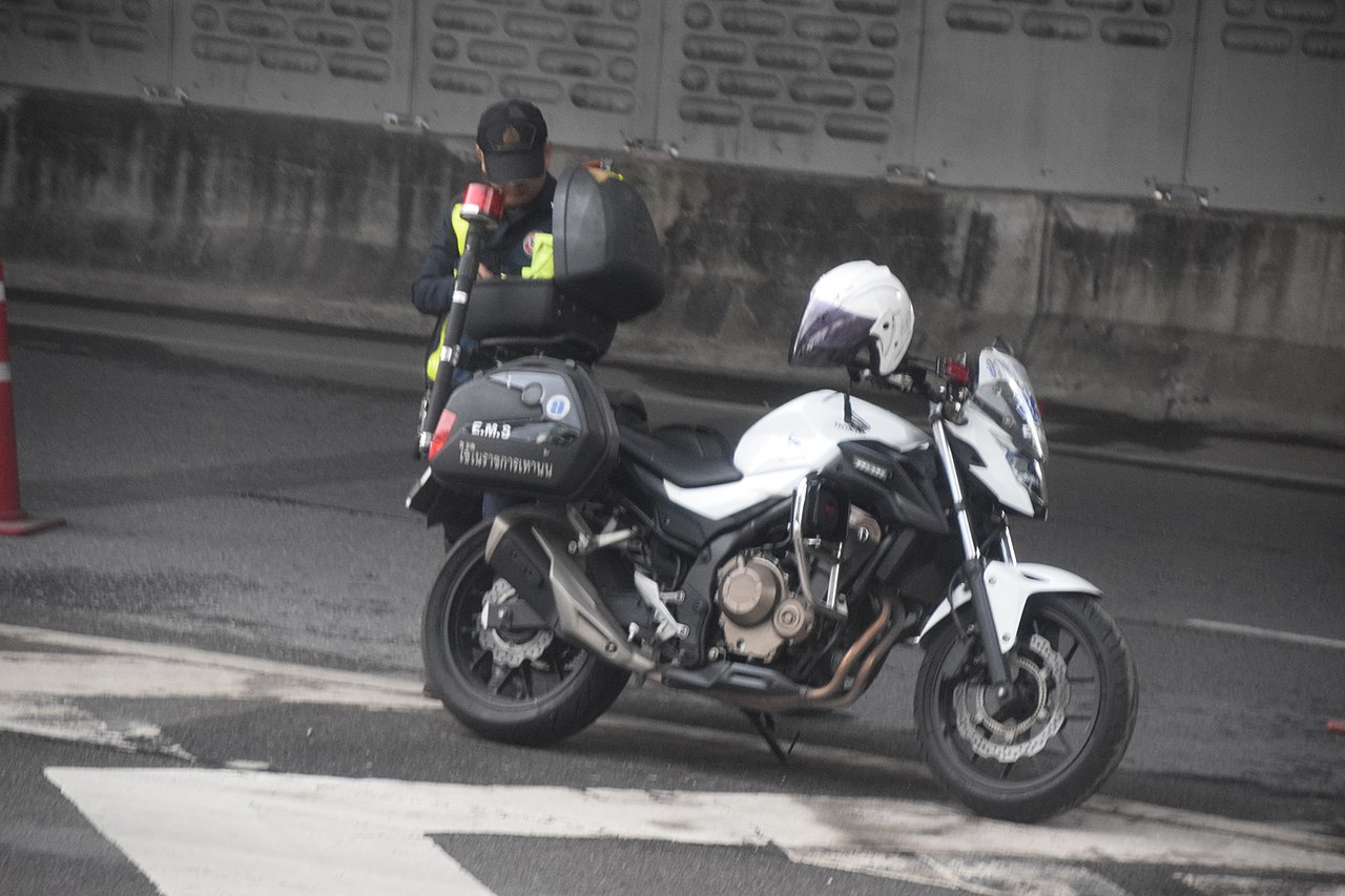 Thai police motorbike at road checkpoint
