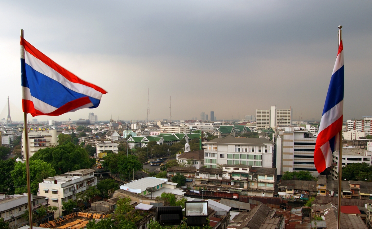 Thai flags and Bangkok skyline.
