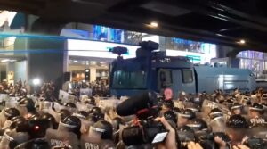 Thai police water cannon at protest site