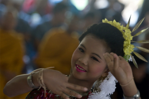 A Thai student performs a cultural dance