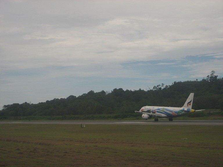Aircraft taking off at Phuket international airport runway