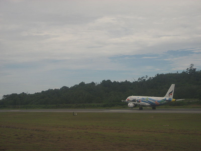 Aircraft taking off at Phuket international airport runway