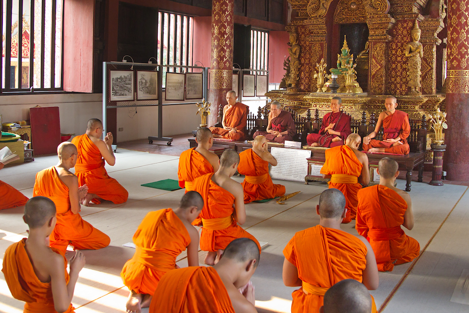 Buddhist monks in the ubosot of Wat Phra Singh, Chiang Mai