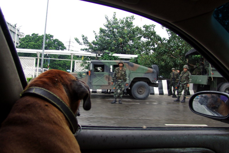 Soldiers of the Royal Thai Army near a Humvee vehicle in the streets of Bangkok after the coup