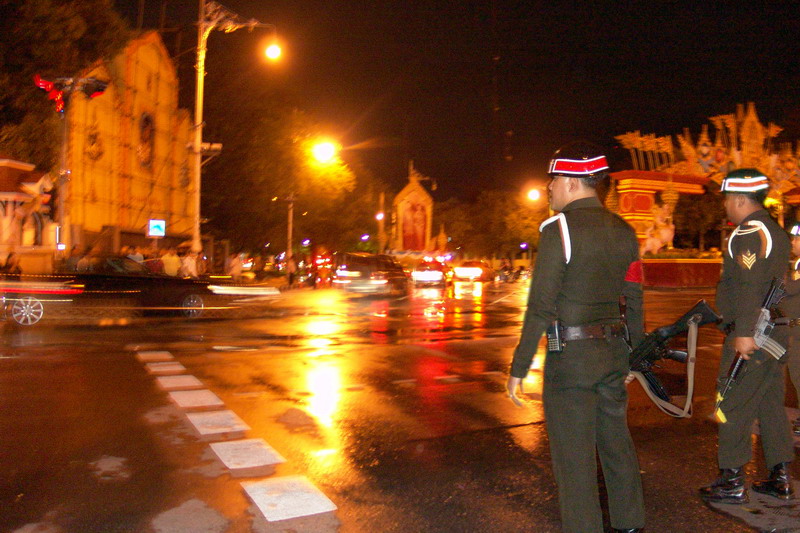 The military leaders on their way from the royal palace as military police look on during a coup d'etat in Thailand