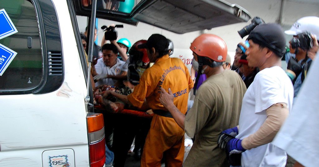 Injured man hauled in to the ambulance