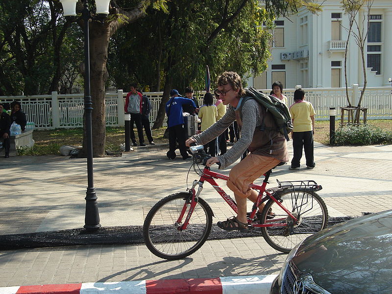 Foreigner riding a bicycle in Chiang Mai, Thailand