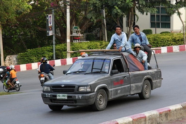 Workers in a pickup truck in Chonburi, Thailand
