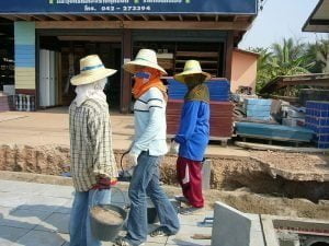 Women working on construction site in Isan