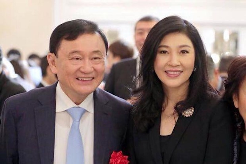 Thaksin Shinawatra and his sister Yingluck Shinawatra in Tokyo, Japan