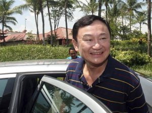 Thaksin’s lese majeste case pending further investigation