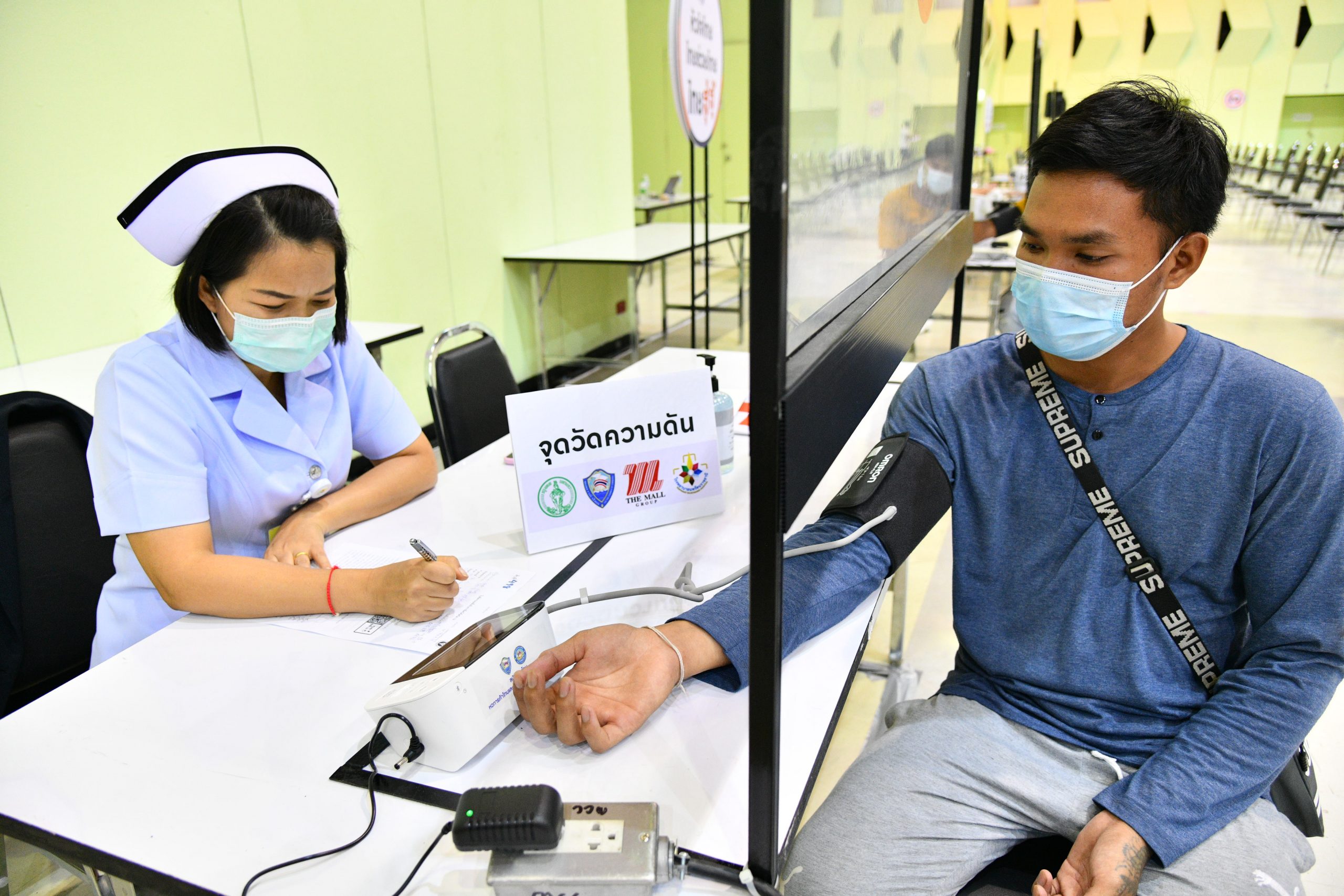 Blood pressure measurement before get the COVID-19 vaccine at The Mall Bangkapi in Bangkok