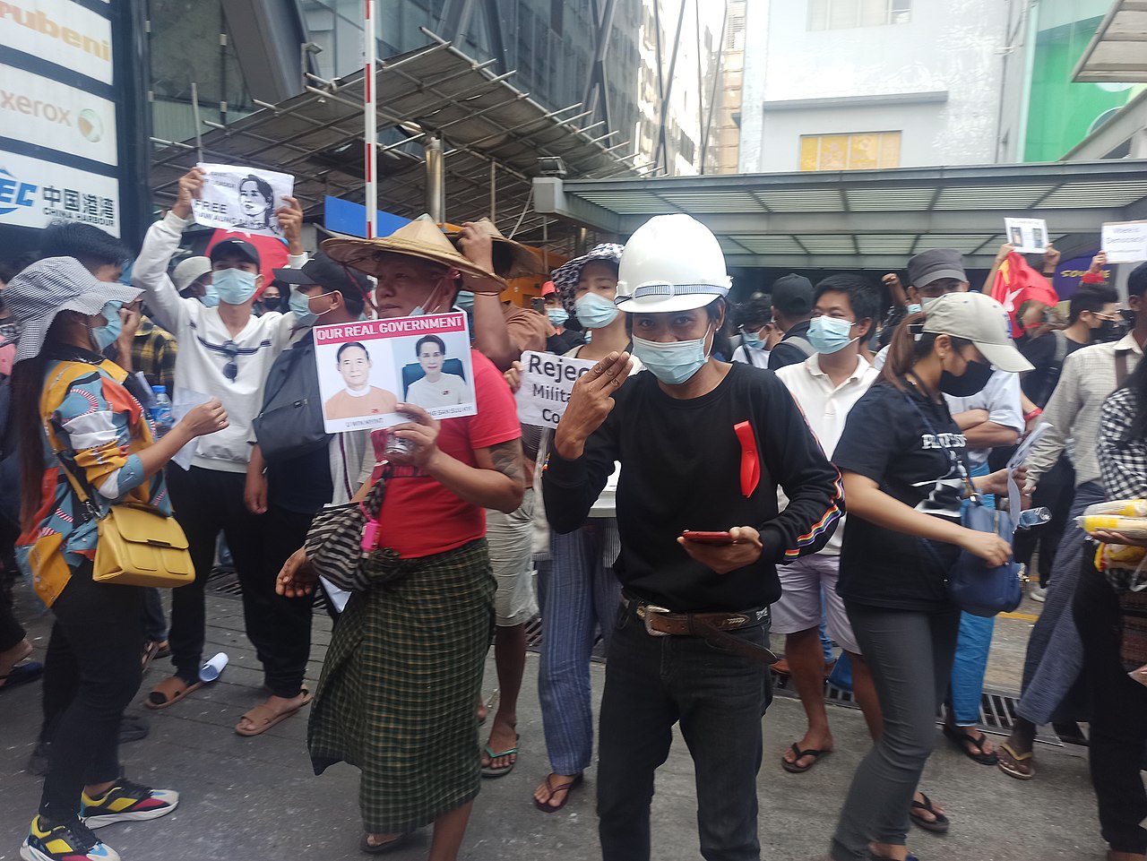 A supporter of the National League for Democracy gives a three-finger salute at an anti-coup protest in Yangon, Myanmar