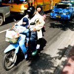 Three Muslims riding a Motorcycle in Ramkhamhaeng Road, Bangkok