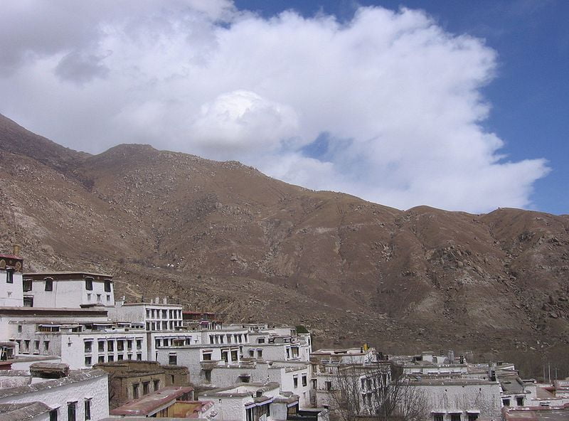 View of Tibet's Drepung 'Bras-spungs, Zhaibung' Monastery, on the outskirts of Lhasa, and the surrounding mountains