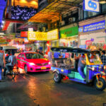 A Tuk Tuk and a Taxi at the Night Market in Pratunam, Bangkok.