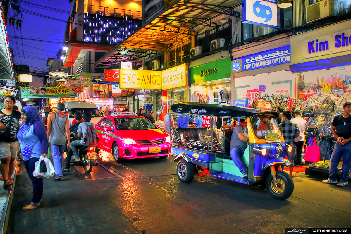 A Tuk Tuk and a Taxi at the Night Market in Pratunam, Bangkok.