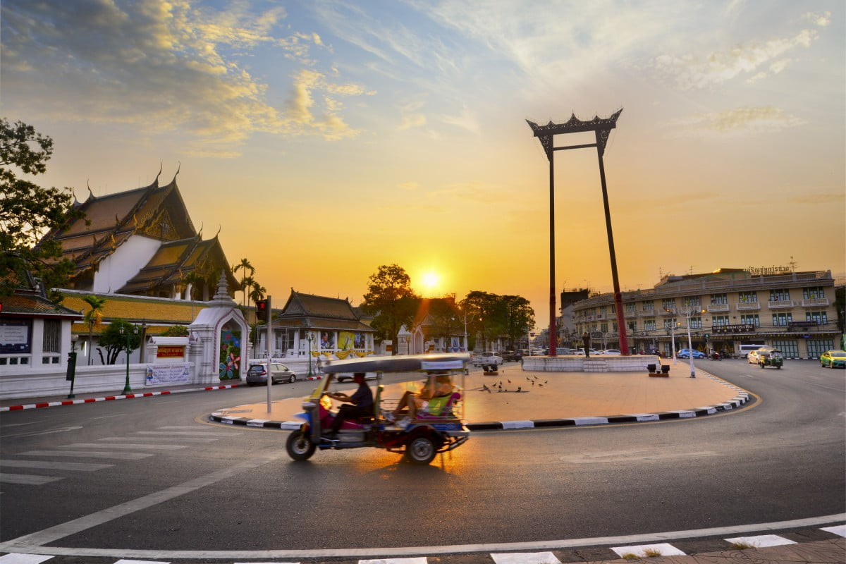 Tuk tuk in front a temple in BKK