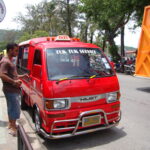 Tuk tuk taxi on Phuket Beach road.