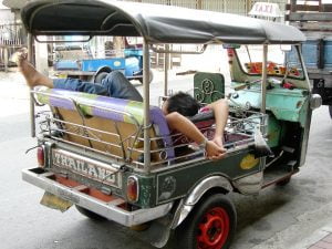 Tuk tuk driver sleeping