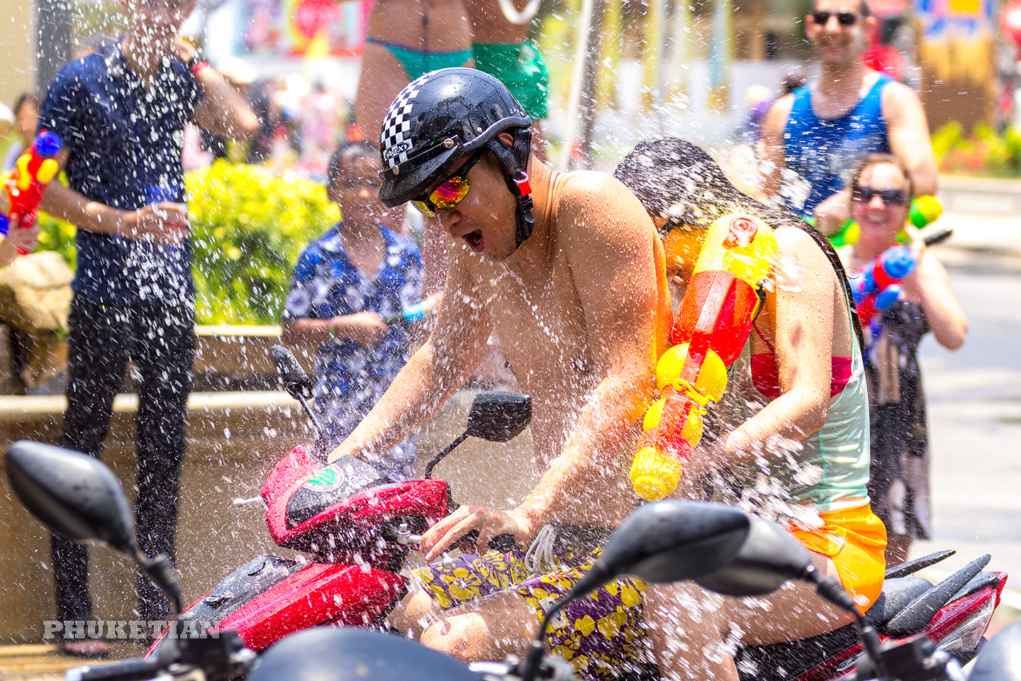 Tourists and residents celebrate Songkran Festival, the Thai New Year by splashing water to each others in Phuket.