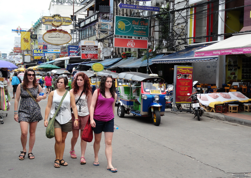 Four tourists on Khao San Road in Bangkok