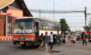 Isuzu bus and passengers at Ubon Ratchathani bus station