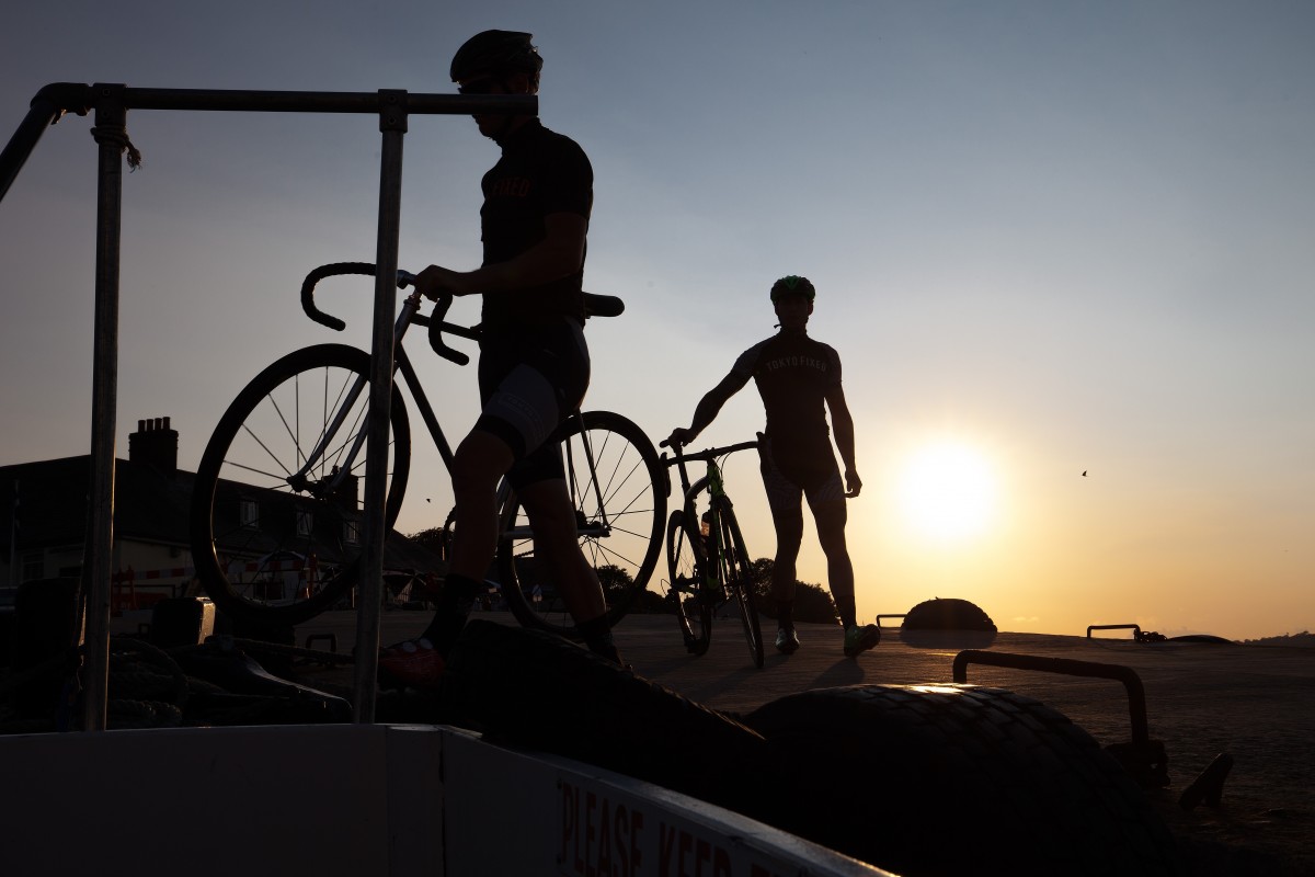 Two cyclists at sunset