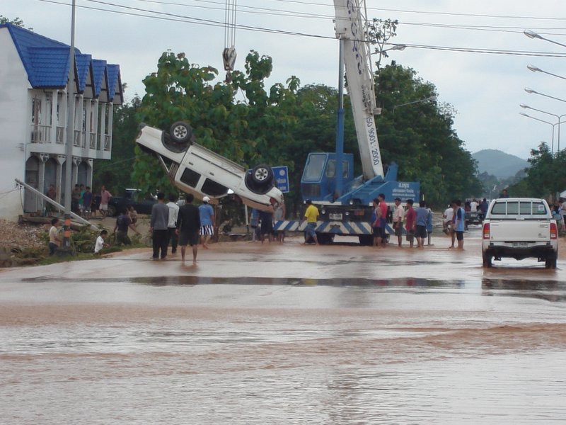 Crane at the site of a road accident due heavy floods in Uttaradit