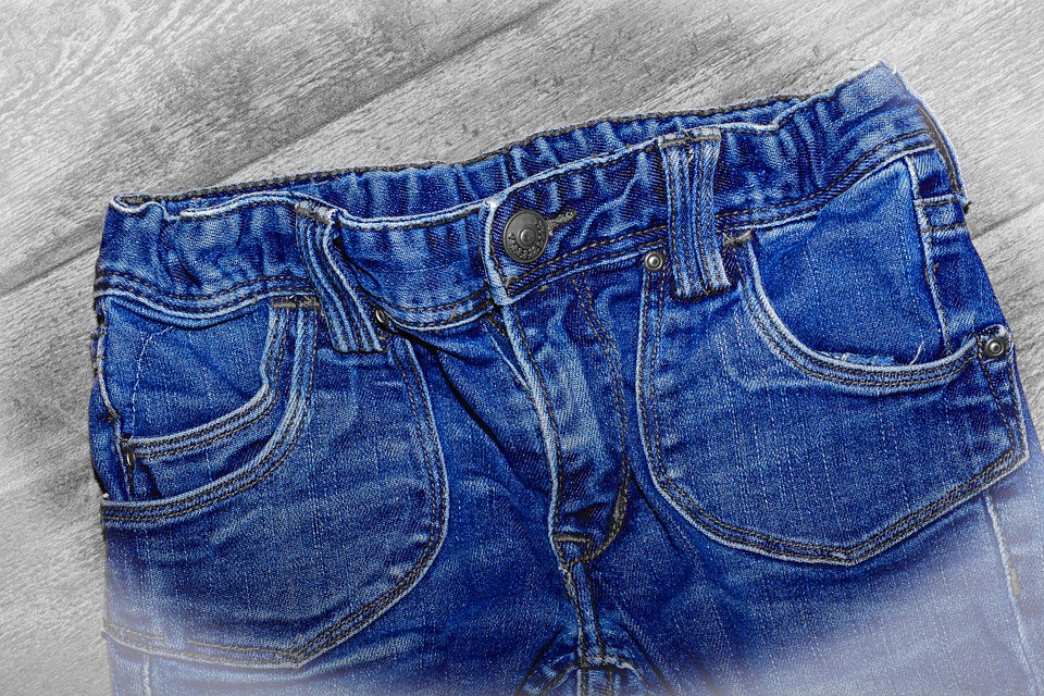 Jeans on a grey wood background
