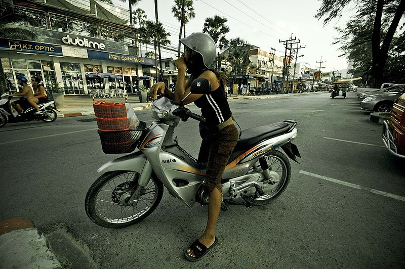 Thai girl riding a Yamaha