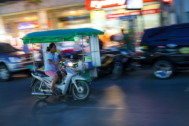 Woman driving a threewheeler in Phuket