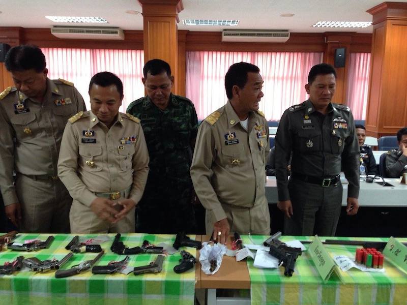 Thai police with seized guns