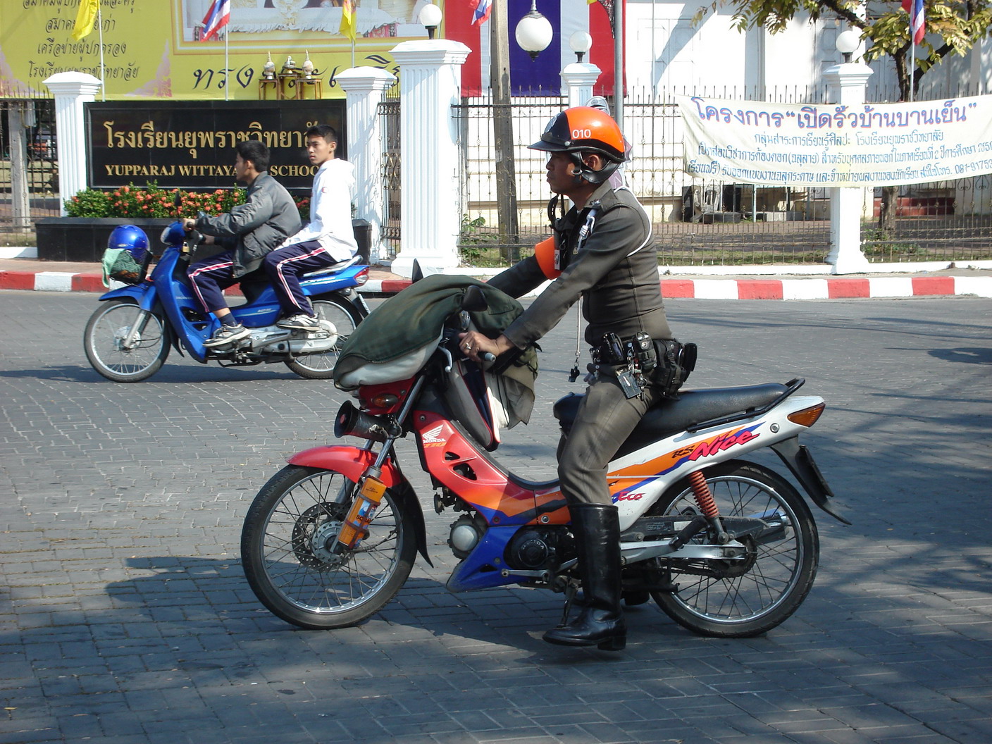 Thai police officer riding a motorcycle