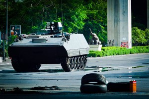 A Type-85 AFV assaulting a Red Shirt barricade in Bangkok