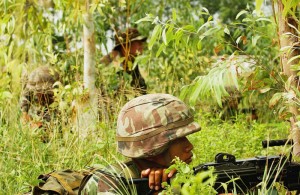 Thai army soldiers practice tactical maneuvers during military operations on urban terrain training in Lop Buri, Thailand, May 18, 2006