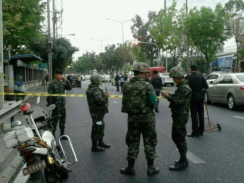 Thai police and soldiers inspecting an area in Bangkok