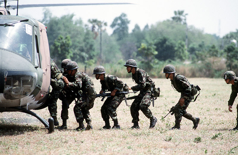 Thai Army soldiers boarding UH-1 1992 helicopter