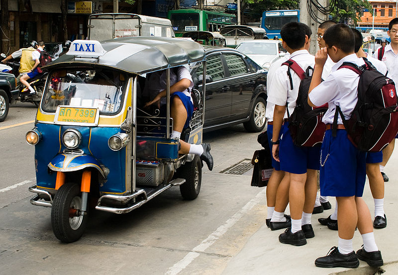 Thai students going to school by tuk tuk