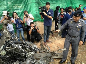 Police inspecting burnt out cars in Thailand's restive South