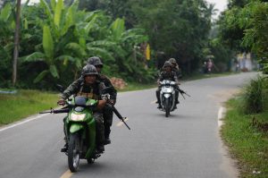 Thai troops patrolling a village in Pattani, to protect Buddhist teachers