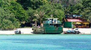 A tugboat near the beach.